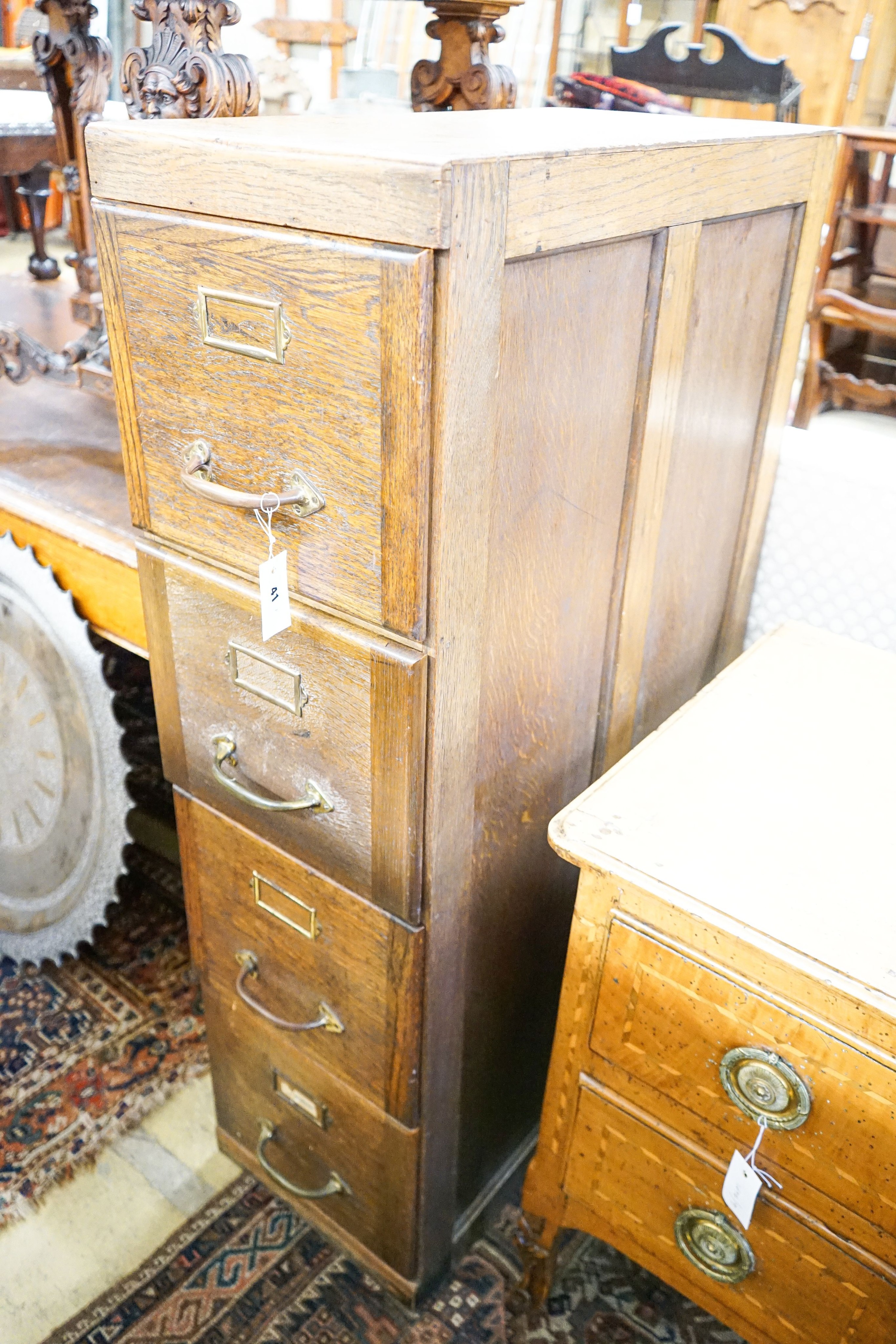 An early 20th century oak four drawer filing cabinet, width 37cm, depth 70cm, height 130cm